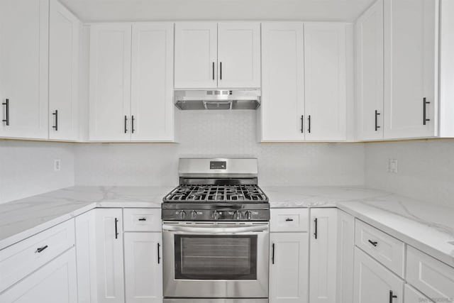 kitchen with white cabinetry, light stone countertops, and stainless steel range with gas stovetop