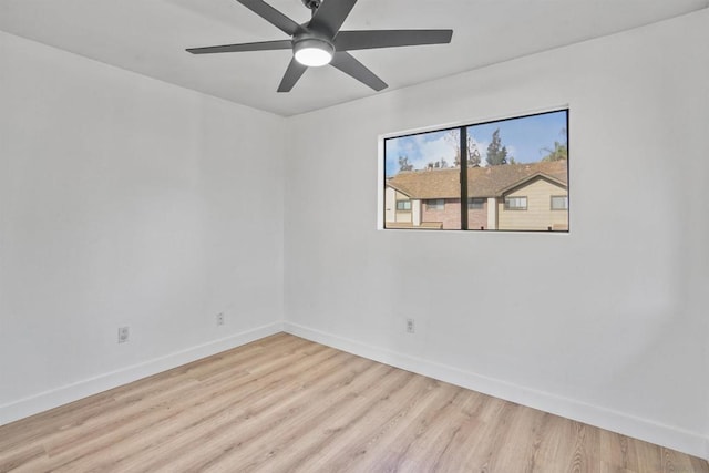 empty room featuring light hardwood / wood-style flooring and ceiling fan