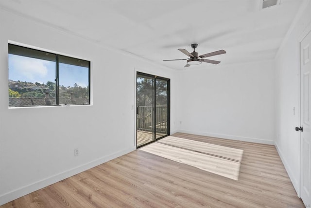 spare room with ceiling fan and light hardwood / wood-style floors