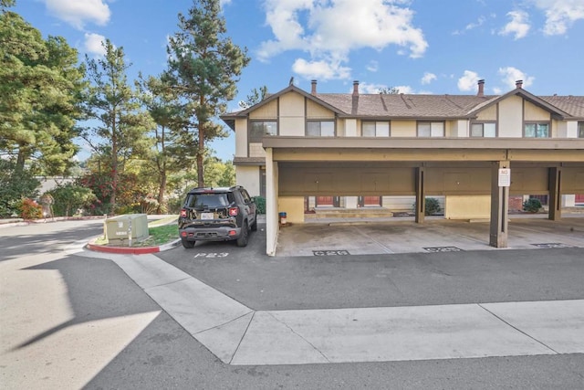 view of parking featuring a carport