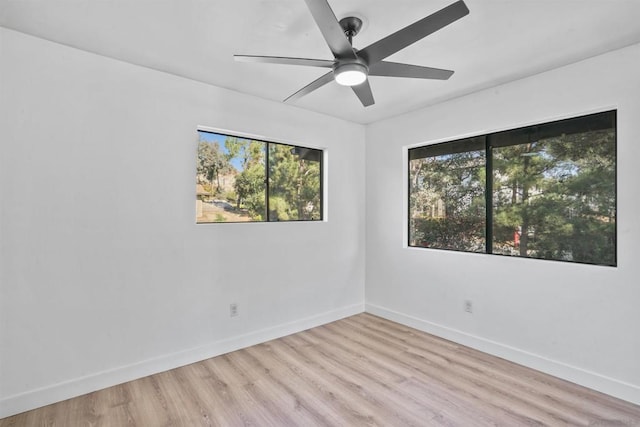 unfurnished room featuring ceiling fan and light hardwood / wood-style flooring