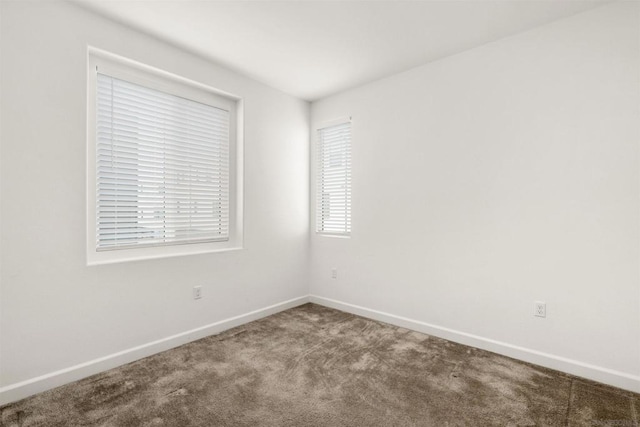 spare room featuring carpet