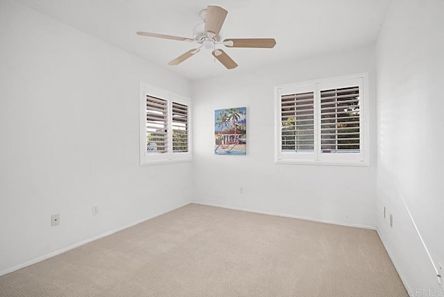 carpeted empty room with ceiling fan