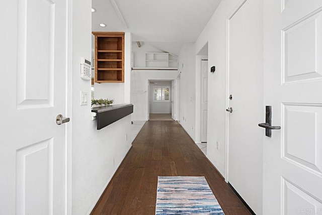 hallway with dark wood-type flooring