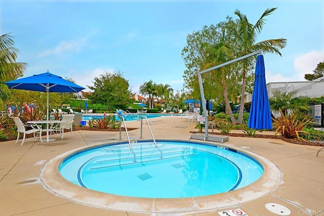 view of swimming pool featuring a patio area