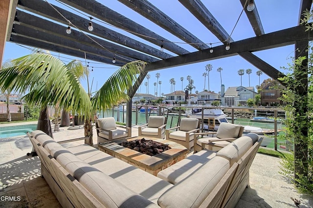 view of patio with a pergola, an outdoor living space with a fire pit, and a water view