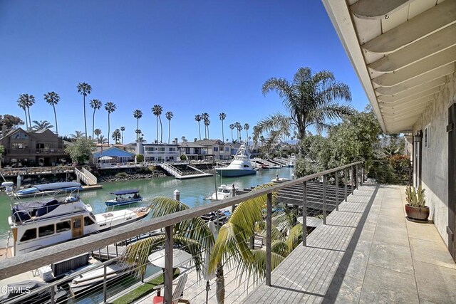 balcony featuring a water view