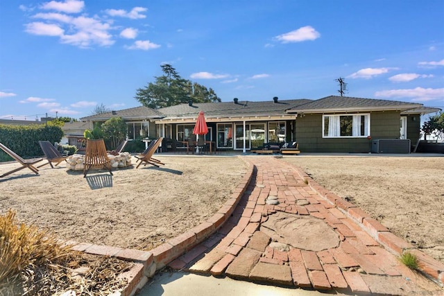 back of property with a patio