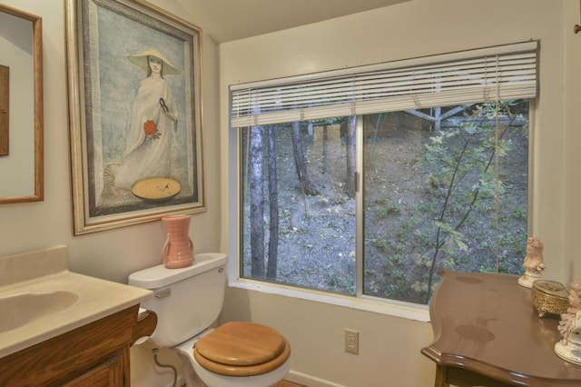 bathroom featuring vanity and toilet