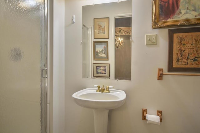 bathroom with a shower with shower door