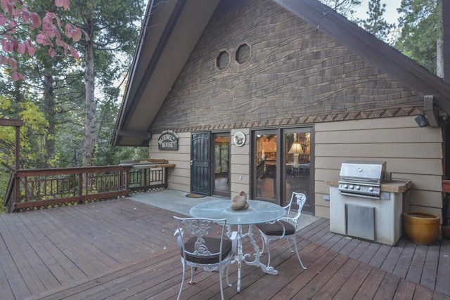 wooden deck with grilling area