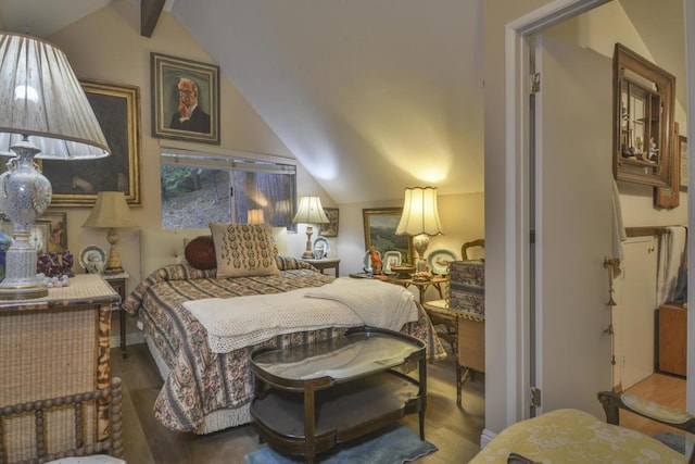 bedroom featuring hardwood / wood-style flooring and lofted ceiling