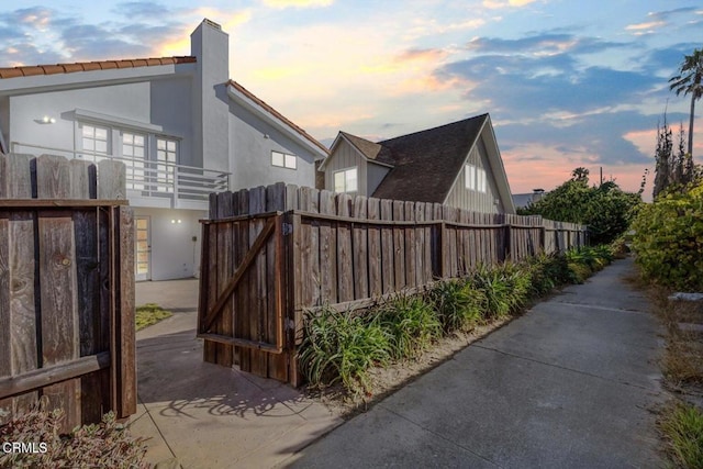 view of property exterior at dusk