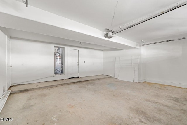 garage featuring a garage door opener and gas water heater