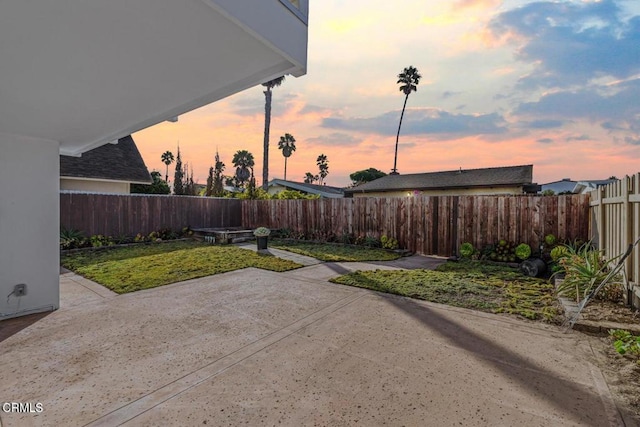 patio terrace at dusk with a yard