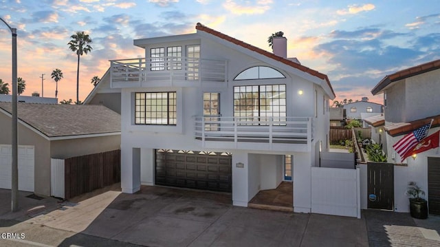 view of front of house with a balcony and a garage