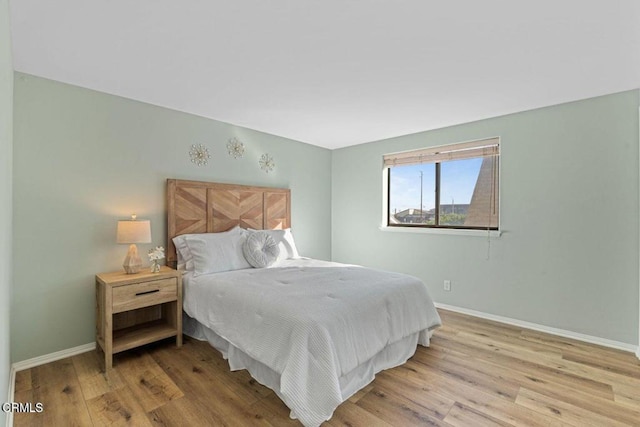 bedroom with light hardwood / wood-style flooring