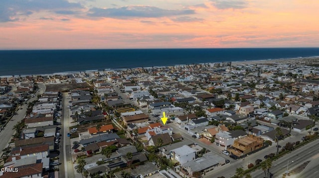 aerial view at dusk with a water view