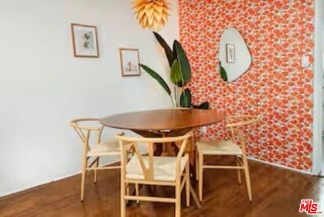 dining area with hardwood / wood-style flooring