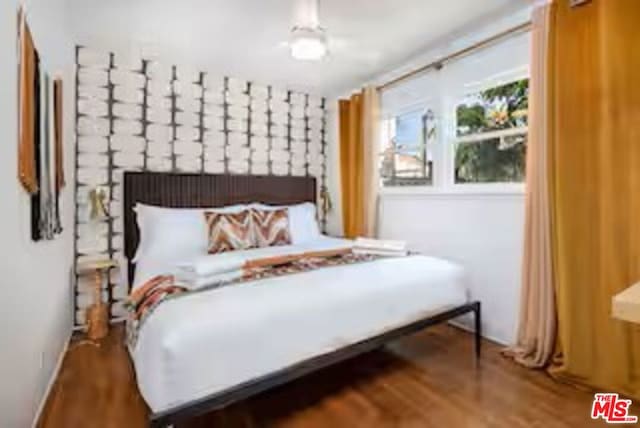 bedroom with wood-type flooring