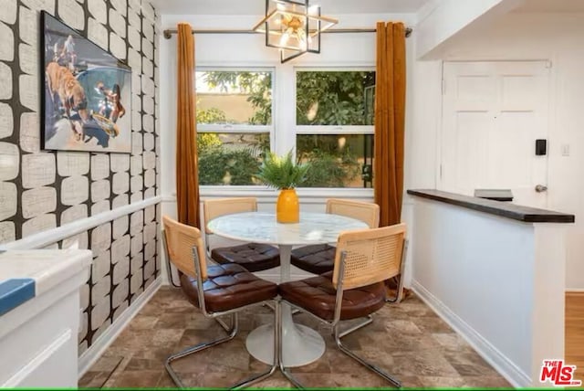 dining area with a notable chandelier