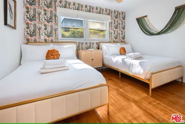 bedroom featuring wood-type flooring