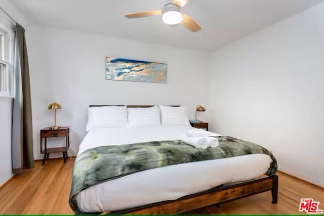 bedroom featuring ceiling fan and light hardwood / wood-style floors