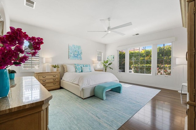 bedroom with ceiling fan and dark hardwood / wood-style flooring