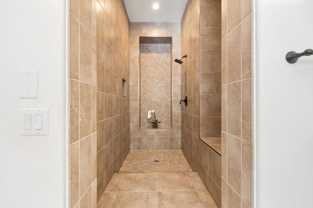 bathroom featuring tiled shower