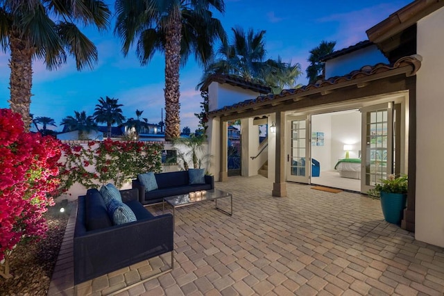 patio terrace at dusk with an outdoor hangout area