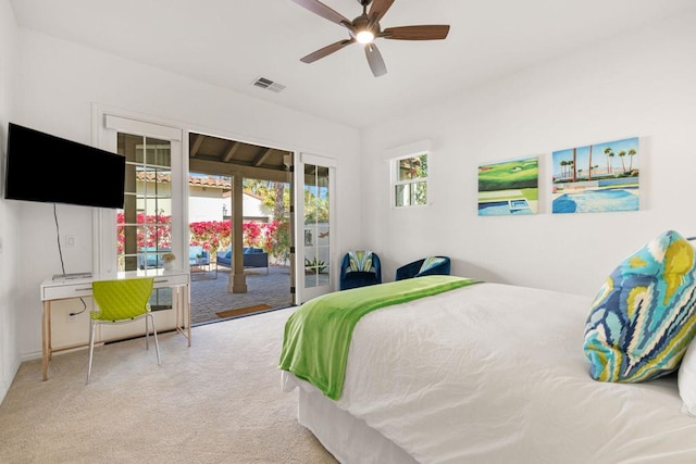 bedroom with access to outside, light colored carpet, and ceiling fan