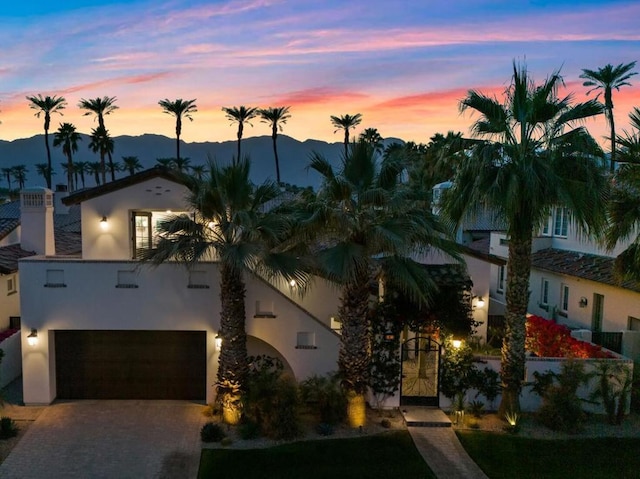 view of front of home featuring a mountain view and a garage