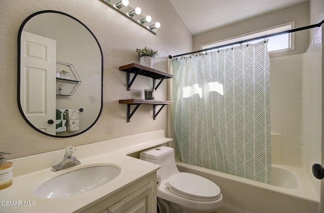 full bathroom with vanity, shower / tub combo with curtain, and toilet