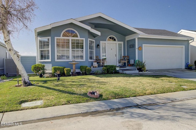 view of front of home featuring a garage and a front yard