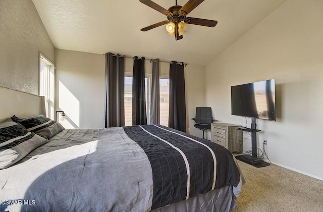 bedroom featuring ceiling fan, vaulted ceiling, and carpet