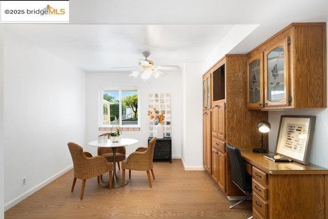 dining room featuring light hardwood / wood-style floors and ceiling fan