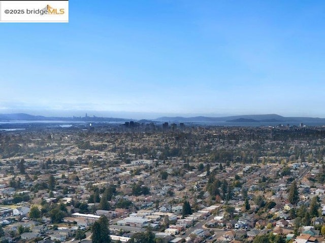 drone / aerial view featuring a mountain view