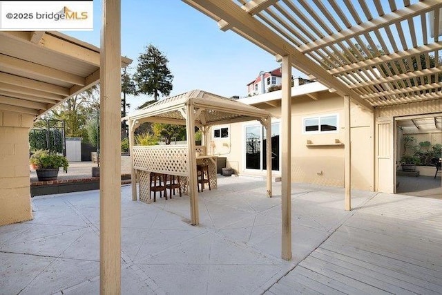 view of patio / terrace with a gazebo and a pergola