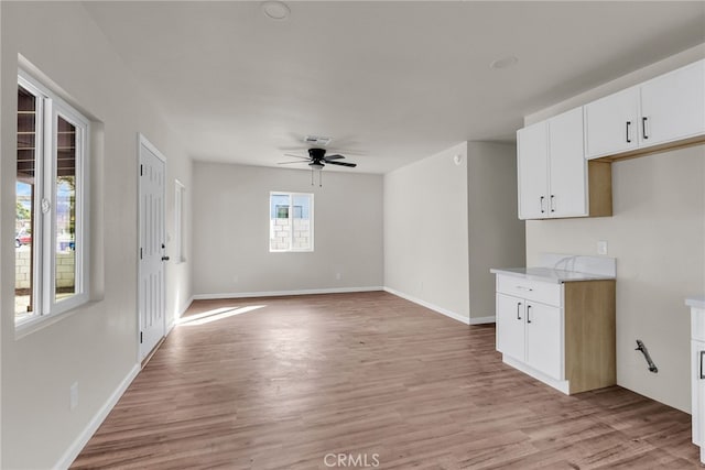 interior space featuring ceiling fan and light wood-type flooring