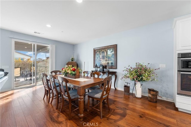 dining room featuring dark hardwood / wood-style flooring