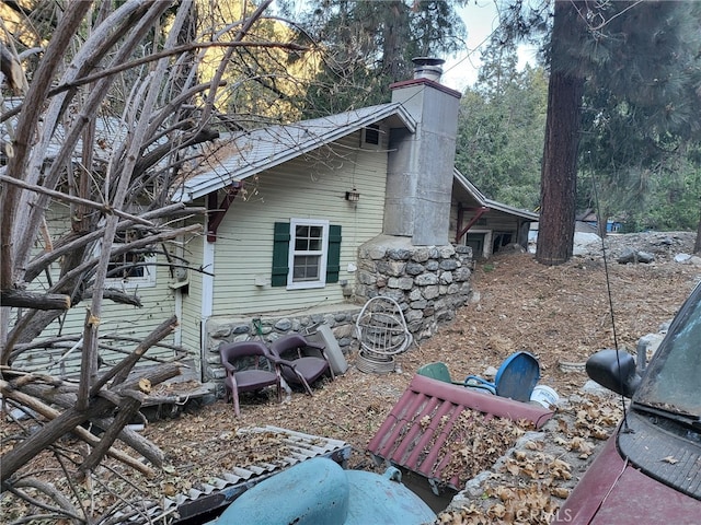 view of home's exterior featuring a chimney