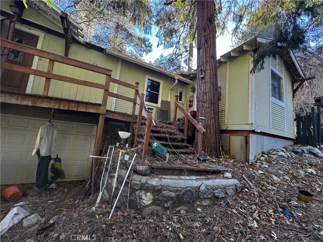 back of property with an attached garage