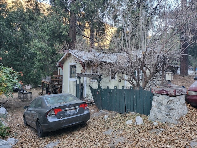 view of home's exterior featuring fence