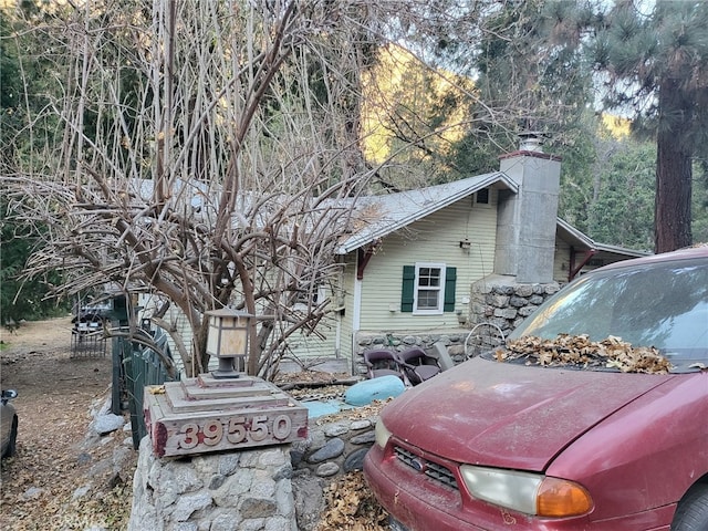 view of side of property with a chimney