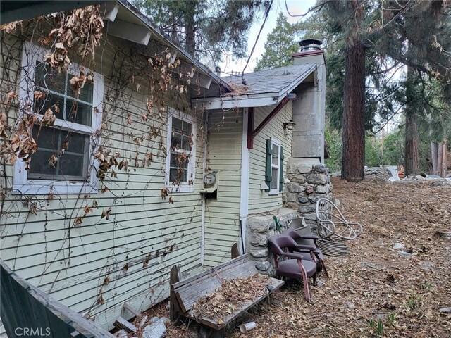 view of side of property with a chimney