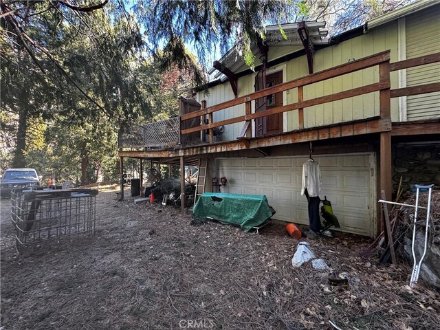 back of property with an attached garage