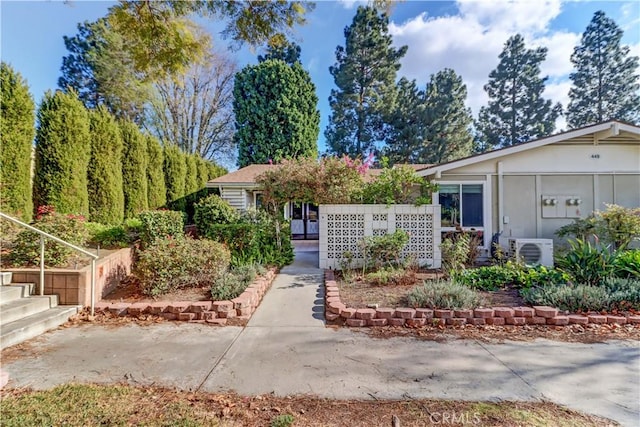 view of front of property with ac unit