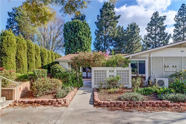 view of front of home featuring ac unit