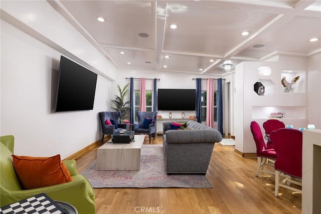 living room with beamed ceiling, coffered ceiling, and light hardwood / wood-style floors