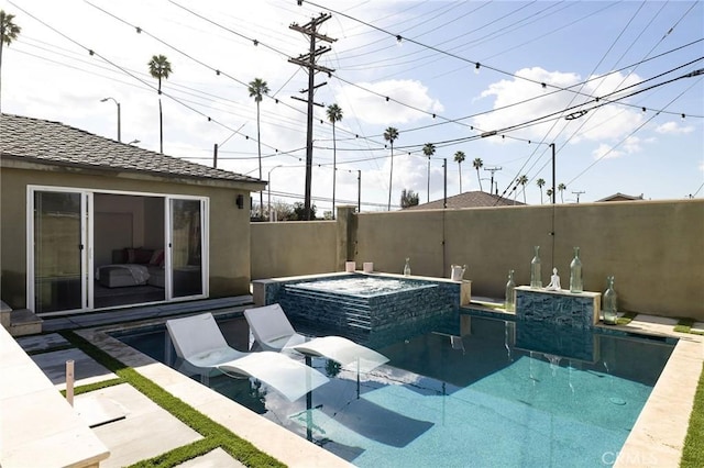 view of pool with an in ground hot tub